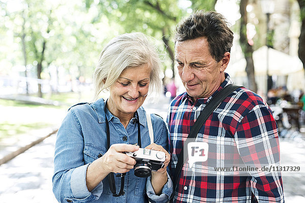 Senior couple looking at camera