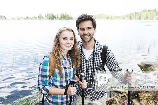 Young couple on a hiking tour at a lake