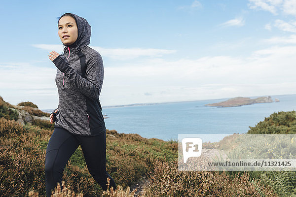 Ireland  Howth  woman running on coastal path