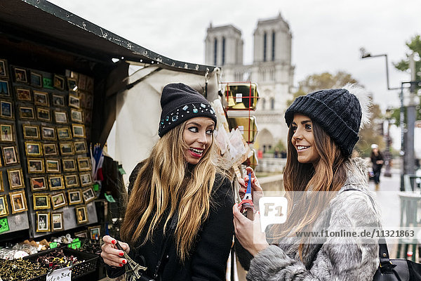 France  Paris  two friends looking for souvenirs