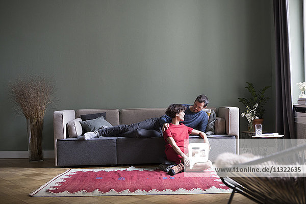 Couple relaxing together in the living room