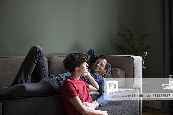 Couple relaxing together in the living room