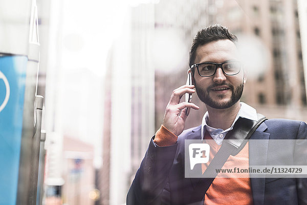USA  New York City  Businessman using smart phone