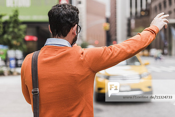 USA  New York City  Businessman hailing cab