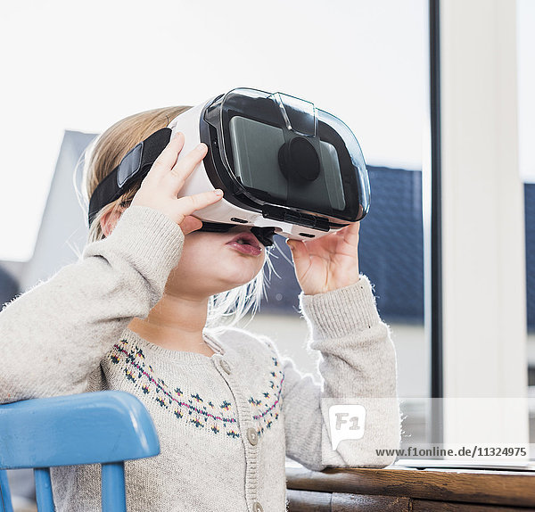 Little girl using VR glasses