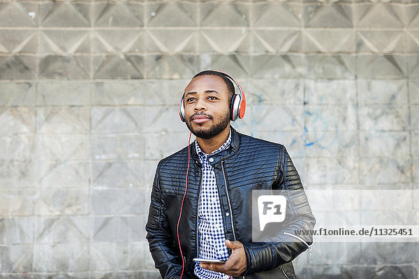 Young man with headphones and smartphone