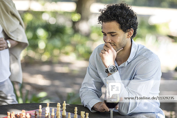 Man playing game of chess thinking