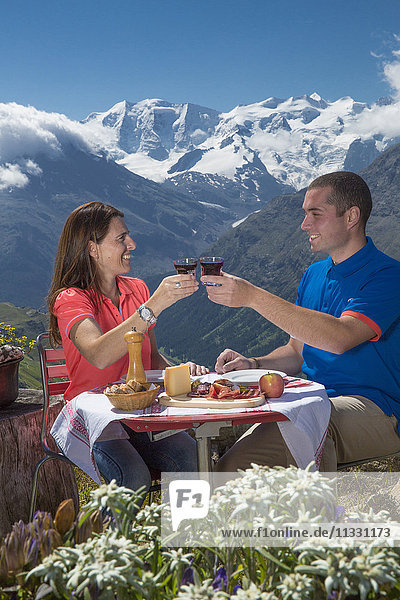 Couple eating at Segantinihütte at Bernina in Upper Engadine  Grisons