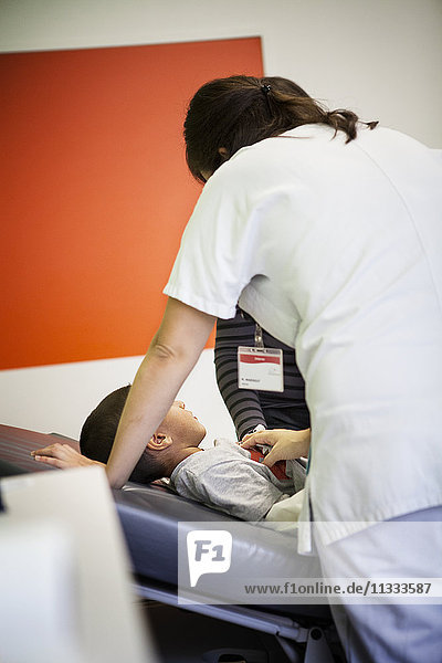 Reportage in the pediatric emergency unit in a hospital in Haute-Savoie  France. A doctor examines a young patient.