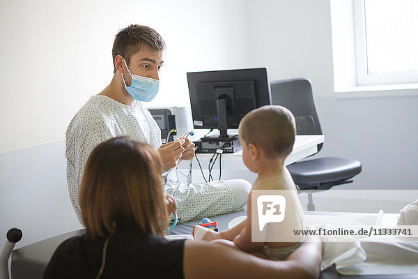 Reportage in the pediatric emergency unit in a hospital in Haute-Savoie  France. A doctor examines a young boy.