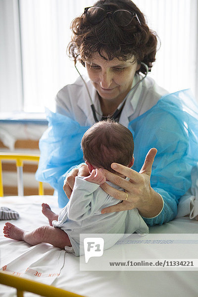 Reportage in the pediatric unit in a hospital in Haute-Savoie  France. A doctor examines a hospitalised baby.
