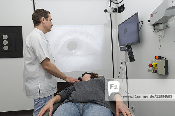 Reportage on an ENT doctor in Nice  France  treating patients suffering from dizziness. A 65-year old patient during a videonystagmoscopy test. Using a videonystagmoscopy mask that films the eye using infrared  an analysis of the stability of eye movement is carried out  looking for a nystagmus. If the test reveals unstable eye movement in various conditions  this will provide vital information on the origin of the symptoms of dizziness.
