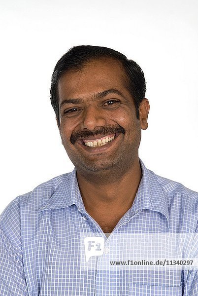 Portrait of a happy mature Indian man.