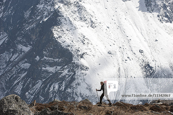 A trekker makes her way to Everest Base Camp  Khumbu Region  Himalayas  Nepal  Asia