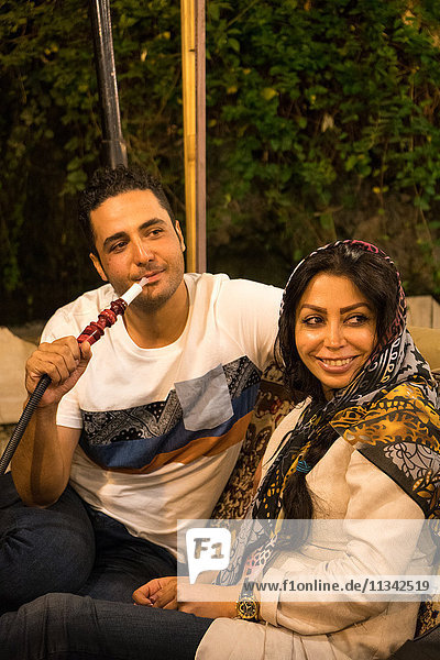 Couple on night out in traditional restaurant  Darband  Northern Tehran  Iran  Middle East