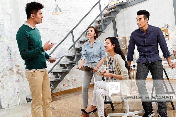 Business men and women work in the studio