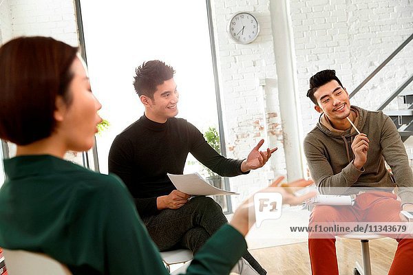 Business men and women work in the studio