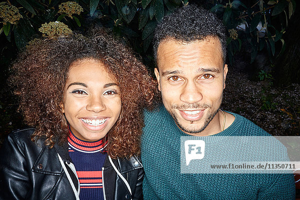 Portrait of smiling young couple outdoors