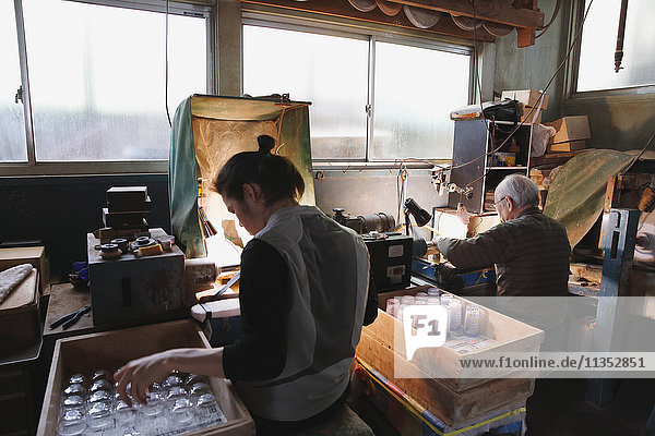 Edo Kiriko traditional Japanese glassware artisans working in the studio