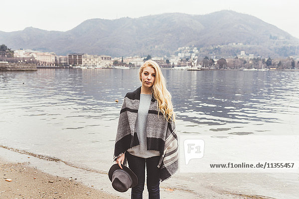 Portrait of stylish young woman on lakeside  Lake Como  Italy