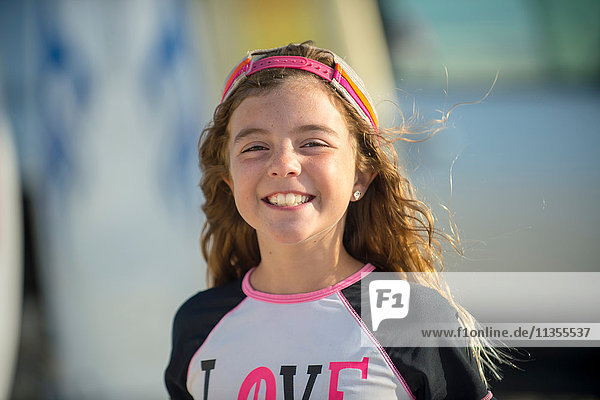 Portrait of young girl at beach  smiling