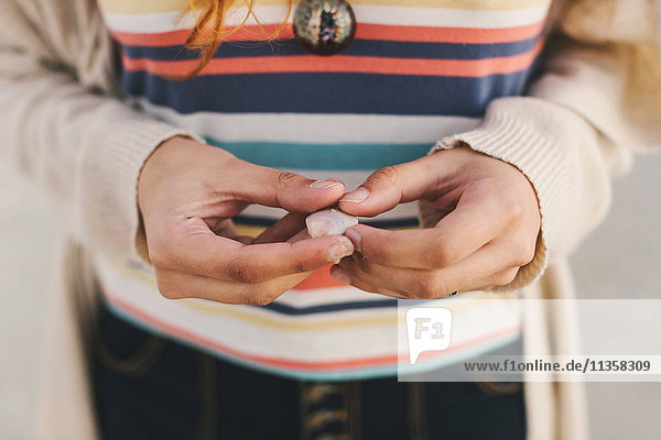 Woman holding seashell