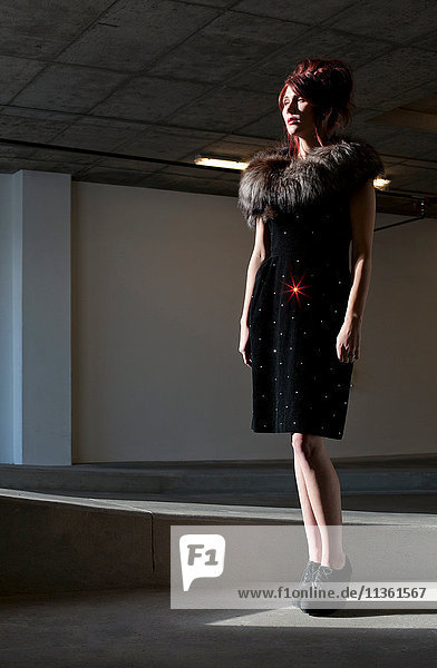 Full length image of fashion model looking away