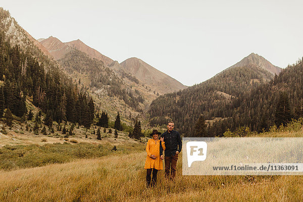Portrait of couple standing in rural setting  Mineral King  Sequoia National Park  California  USA