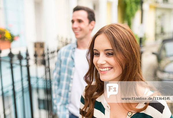 Couple in street smiling