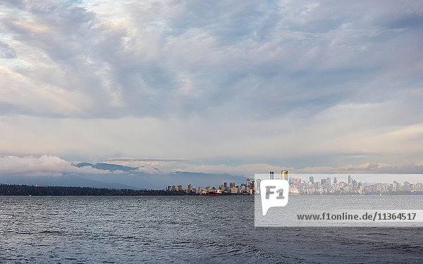 Distant view of city skyline over Vancouver harbour  Vancouver  Canada