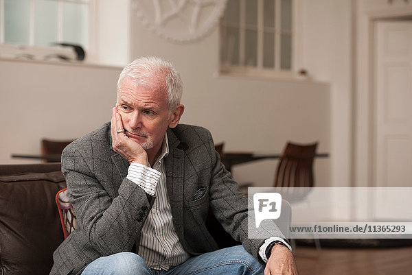 Man looking upset on couch
