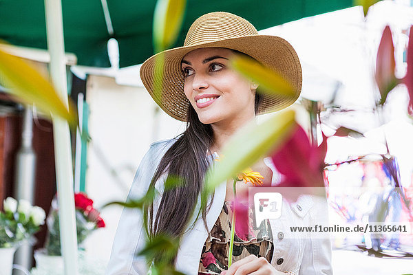 Young female tourist at flower market stall  Split  Dalmatia  Croatia