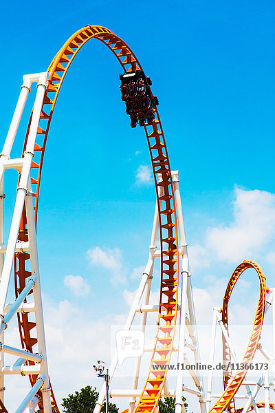Low angle view of looped roller coaster at Coney Island amusement park  New York  USA