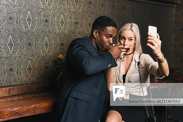 Couple in pub taking a selfie