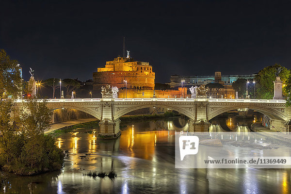 Bridge and Ponte SantAngelo illuminated at night  Rome  Italy