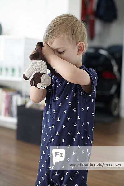 Boy holding stuffed toy