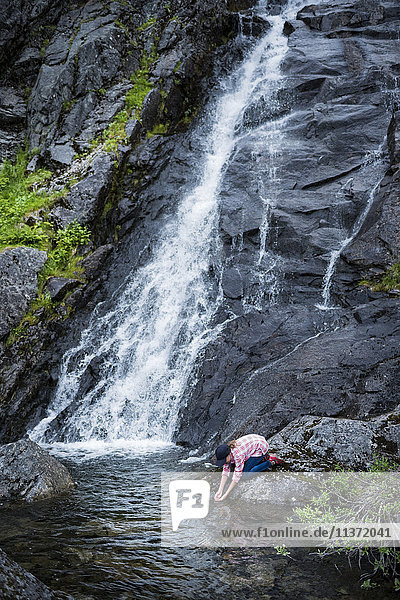 Girl near waterfall