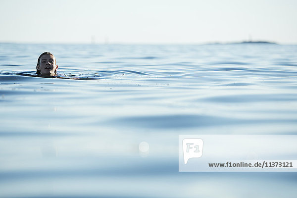 Teenage girl swimming in sea