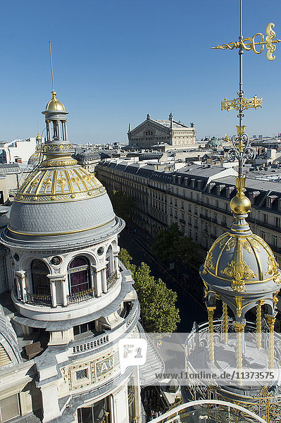 France. Paris 9th district. Turret of the department store Au Printemps. Far off: the Garnier Opera