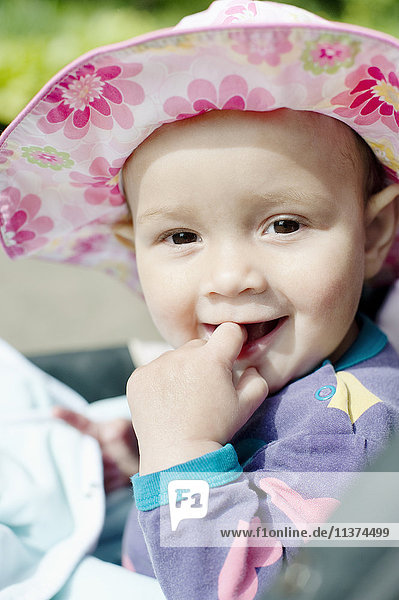 Portrait of baby girl in sun hat