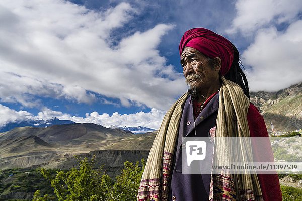 Portrait of Sadhu  holy man  looking into the himalayan mountains  Muktinath  Mustang District  Nepal  Asia