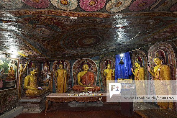 Buddha statues  murals  frescoes  interior  Aluvihara Rock Temple  Matale  Central Province  Sri Lanka  Asia