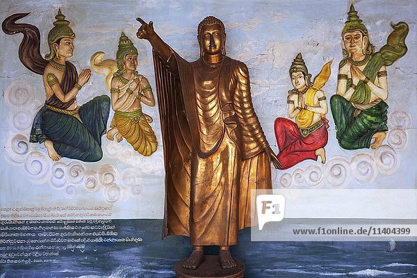 Bronze Buddha statue  Standing Buddha  mural  Weherahena Temple  Matara  Southern Province  Sri Lanka  Asia