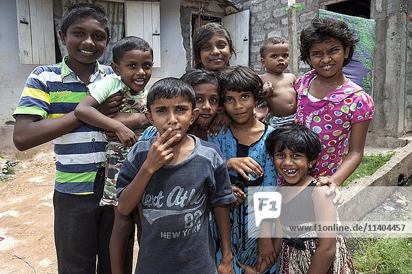 Local children standing outside house  Sinhalese  Beruwela  Western Province  Sri Lanka  Asia