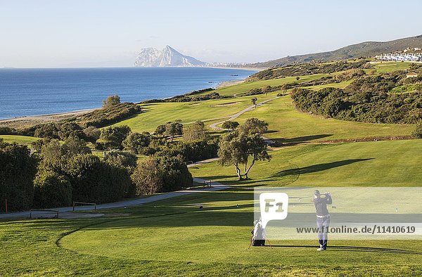 Golfer at La Alcaidesa Golf Resort with Mediterranean Sea and Rock of Gibraltar  Cádiz  Andalusia  Spain  Europe