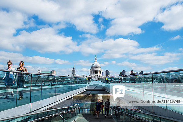 'Crossing Millennium Bridge to St Paul's Cathedral; London  England'