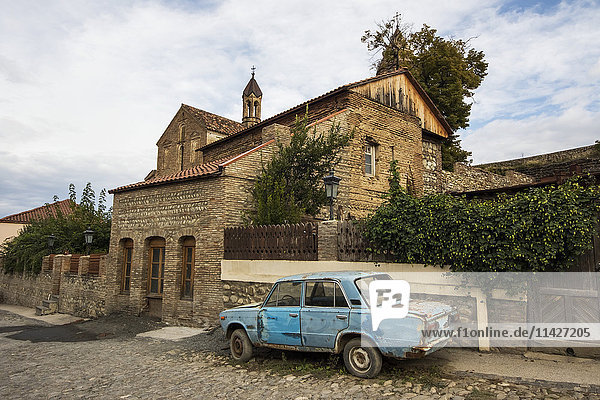 'Lada parked by the Church of St. George; Sighnaghi  Kakheti  Georgia'