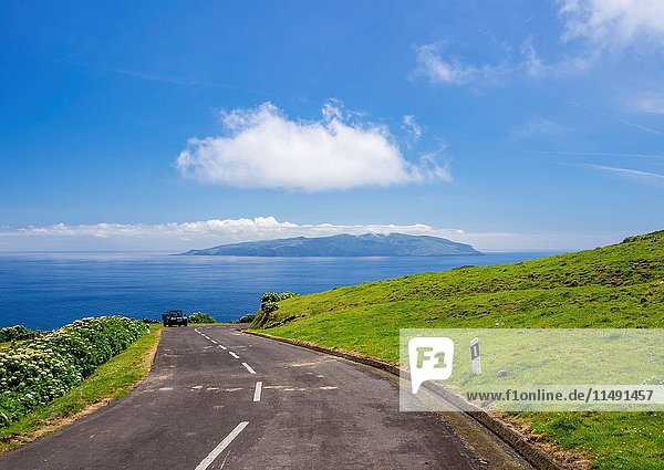 Portugal  Azores  Corvo  Road leading to Caldeirao and Flores Island on the horizon.