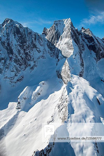 Aerial view of Spigolo Badile in winter. Val Bondasca  Val Bregaglia  Canton of Grisons Switzerland Europe.