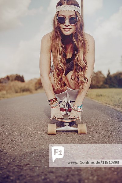 Yong woman with skateboard